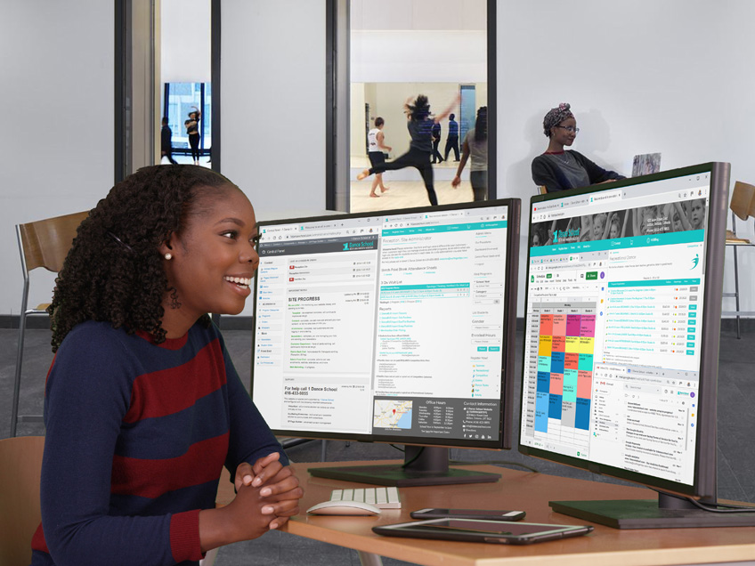 receptionist using dual monitors